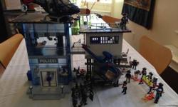 Complete Police Playmobil set including 2 Helicopters, Police Station incl. alarmed prison, Police Transporter, Special Unit Racer, Police People, Special Forces, Thieves, road stop equipment, bicycles and animals. Great fun and our kid enjoyed playing