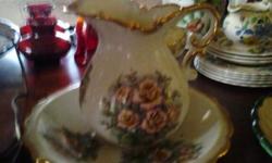 very pretty vase and matching plate- rose design-excellent condition- $25.00. please call 845-679-4291