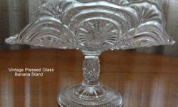 Vintage Pressed Glass Pedestal Banana Stand-Excellent condition. 10 Â½? long, 6 ? wide, 7? high. No marks ,but may be Bryce Higbee. Many uses--such as bathroom guest towel holder, bunch of grapes holder, floral display, etc.