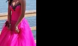 Still looking for a prom dress? Hot pink (pink lightening) with black trim. made by Posh Precious, was $450.00 new on sale for $225. Size 2 on label, can be sized a little bigger - there is a double corset on the back. My daughter is an actual size 4.
