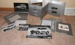 Only $5! Package of promotional literature for the introduction of the PT Cruiser. Includes picture postcards, and special nicely made brochures -"penny for your thoughts" (with penny), "what color do you want..." including color chip cards, "another way