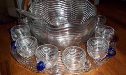 I have a Duncan & Miller Caribbean Wave pattern crystal punch bowl set that comes with the liner plate. There are 8 punch cups as follows: 4 cobalt blue, 3 ruby red and 1 clear. Mint condition $200 (there is a plastic ladle included)
Also, I have an