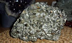 Pyramid Pyrite Crystal-This Beautiful Specimen of Pyrite is also known as fools gold. This is large rare mineral ore, in the family of gold and copper ore. In the front of the pyrite, pyramid cut crystals very rare, one of a kind. Measurements 5" Tall, 7