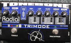 Used, one owner, immaculate condition. Perfect. Original manual and power supply included.
The 12AX7 tube-equipped Radial Tonebone TriMode Distortion Pedal has true-bypass and 2 distorted channels with separate input drive and output level controls. It