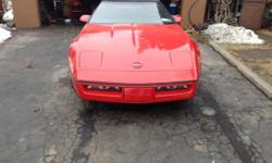 Red corvette convertable, mint condition, automatic, A.C., C.D. player, and garage kept.