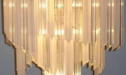 TRULY STUNNING CHANDELIER WHETHER LIT OR UNLIT!
3 TIERS OF CASCADING PRISMS, ALTERNATING FROM
CLEAR TO OPAQUE TO CLEAR, ETC.,
THAT CATCH THE SUNLIGHT OR LAMPLIGHT!
24" WIDE AND 24" HIGH WITH A 30" HANGING CHAIN.
BRASS HOUSING HAS 13 LAMPS
(4 ON EACH TIER