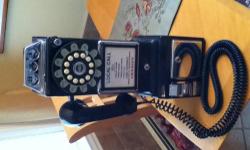 Retro pay phone with push button numerals. Excellent condition. Receiver has 20 foot cord. Great conversation piece for the home or bar room.