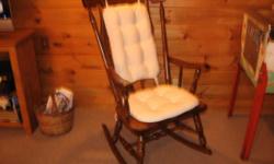 Medium to dark hardwood well-made rocking chair in very good condition. Has back and seat pads, rocks well. Wood on seat is very thick.
Please call before 9 PM.