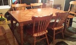 Round Wood Kitchen/dining room table. Seats 4. I only have 3 matching chairs. But I do have an extra wood chair to go with it.