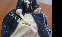 Royal Doulton " Laurianne" Hn 2719 bone china figurine. Issued 1973- Retired 1979This is a beautiful piece from my private collection and is in excellant condition. No cracks, chips or crazing. Beautiful royal blue and powder blue gown. Approx. 6 1/2 "