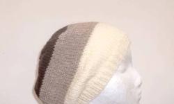The colors in this knit beanie slouch hat are a winter white, tan and brown. This wool beret is made with a soft 100% pure new wool yarn. Knitted in three large stripes. It is a medium thickness, very stretchy, will fit any head, will stretch out to 31