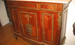 This auction is for a vintage marble topped sideboard, marble top is not original to the piece and is actually two pieces of marble, very clean, some of the veneer has peel and needs to be repaired or can be left as is for character, brass is beautiful,