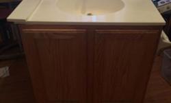 Sink and vanity with faucet included. Side splash also included.Recently removed for remodel. Upper back of vanity removed for uninstall but from and sides perfectly intact. See photos.