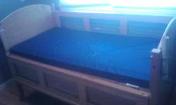 I have a SleepSafe 2 Plus handicap bed. The head and feet of this bed are adjustable; however, the bed itself does not raise and lower. There are plastic safety rails on the sides and rollers on the bottom. The mattress has a plastic covering, and is