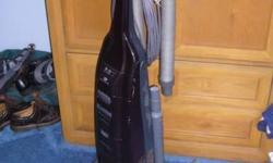 slightly used Kenmore Progressive 12 amp upright vacuum cleaner with direct drive, dirtsenser, HEPA filter, bag & hose check, overload reset button, height adj, agitater on/off button. Includes owners manual and all hoses and tools stored on the handle,