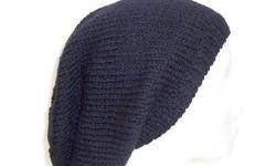 A very comfortable hat. This handmade slouch hat is solid black. Suitable for men and women. It is made with a soft pure wool yarn. Completely hand knitted. Large size. Medium thickness, very stretchy, will fit any head, stretches out to 31 inches around.