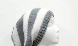 This slouchy beanie hat is perfect for winter, autumn, spring. A comfortable warm and stylish! The oversized beanie hat colors are a medium gray and white. It is hand knitted in 1 Â½ inch stripes . Suitable for men or women. Will fit any head, will stretch