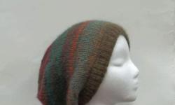 The colors in this slouchy beanie hat are several shades of brown, rust, teal, green, dark orange, a large variety of colors. Very stretchy, will fit any head, stretches out to 31 inches around. The yarn is 53% wool and 47% acrylic. Very soft. Available