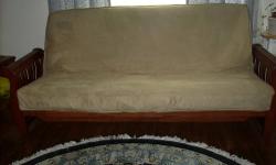 Sofa and Matching chair both have very heavy solid hard wood sleigh style arms with mission style sides. Both pieces have built in magazine/newspaper racks. Frame is also solid hard wood and very well made. This set is in excellent condition. Cushions are