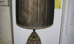 Glass and brass lamp with pleated shade. Antique look. Good condition. call three four seven 989 three one one one or reply to this ad. Thanks for looking!