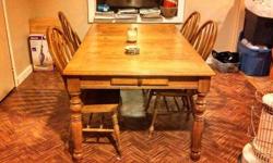 Heavy duty kitchen table with leaf n 4 chairs. Each end of the table has drawers. One chair is missing one bar and there is a small burn on table. Table is very sturdy and heavy. $400 obo.