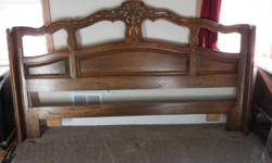 This is a very heavy ornate solid wood headboard it will fit king or California king bed . Local Pick up
