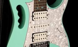 The Ibanez RG350M electric guitar takes the RG series further into the metal zone with a light basswood body and a 24-fret, 3-piece Wizard II neck for fast and effortless shredding. Aesthetic touches include a maple fingerboard with black dot inlays and