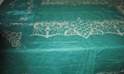 Pictured below are some of the green colored linen items available for sale. The first and third pictures show handmade cross-stitch tablecloths that measures 76 by 58 inches.
The second picture shows matching napkins. Both these tablecloths and napkins