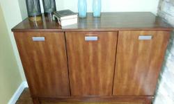 Studio Home Collection 3 Door Cabinet was purchased and shipped directly from Big Furniture Industries in North Carolina. Cabinet is solid wood and in very good condition. Cabinet dimensions are 34 and 3/4 inches high, 45 inches wide, and 18 inches deep.