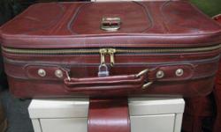 This is a black,small,carry on size suitcase 18: High x 14" Wide
This is not a a full size suitcase.
It is a super light,hard shell suitcase.
It has 2 wheels on the bottom (rear end) and stands upright on its own.
It was never used.But the long, pull