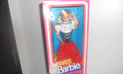 Swiss Barbie Doll / Mattel #7541 ? Collectors Edition / Made In: Taiwan ? Shoes Made In: Philippines ---------- She is a International Fashion Doll ? 11 Â½ ? (29.21 cm) ---------- One-Piece Blouse; Vest; Skirt; Socks; Hat; Shoes; Jewelry; Doll Stand ? and
