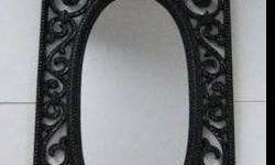 Vintage 1969 Syroco oval wall mirror in black wrought iron look frame. Excellent condition. Overall measures 31Â½? tall x 17? wide. Oval mirror is 19? tall x 9Â½? wide.
Frame is durable molded plastic. Has hanging hooks & wire. Marked on back ?Syroco Made