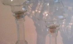 4" taper candle holder
6 1/2" taper candle holder
base measures 3.25" diameter
clear glass
no chips or cracks