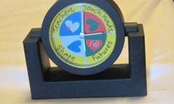 New (unused) black plastic desk clock "Teachers, Touch Minds, Shape Futures", needs a battery