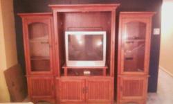 THORNWOOD MED. OAK SOLID WOOD ENTERTAINMENT SYSTEM- Made in the USA by well-respected furniture maker. Excellent condition. Can be divided into TV top with cabinet below, 2 glass and door cabinets and bridge. The 2 side cabinets contains glass opening on