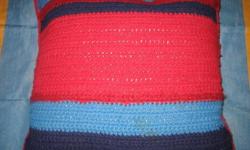 Pictured are two throw pillows. The first is HAND KNIT and is red, black, and blue. It is 17 inches square and about 5 1/2 inches high.
The next pictured pillow is crocheted and is 17 inches by 14 inches and is about 2 inches high.
The package price for