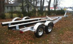 BRAND NEW 2013 TIDEWATER TANDEM LOW PROFILE 5200 POUND TRAILER HD TIRES DISC BRAKES SURELUBE HUBS BUDDY BEARINGS EZ SLIDE BUNKS TONGUE JACK STEEL HD CABLE WITH HD WINCH .....WILL HANDLE UP TO A 22 FOOT BOAT NOT TO EXCEED 5200 POUNDS WE ACCEPT ALL MAJOR
