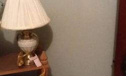 This item is a Tiffany Style Table lamp in very good condition, there is a
tiny crack in the back of the lamp shade. The lamp stands 15 1/2 inches
high, the colors are tan, brown and cream. I had purchased this lamp for
$ 150.00 If you like Tiffany lamps