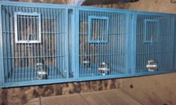Blue triple bird cage, on wheels. Bowls, trays, and keys. Cage is in very good condition and clean.