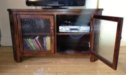 Raymour and Flanigan Wooden TV Stand/Console/Bureau. Glass doors, two, revealing two shelves. Outlet/cable holes for each shelf on each side. Sort of a stone detail on the front leg sides.
Accepting all offers. Need to get it off my hands ASAP. Will