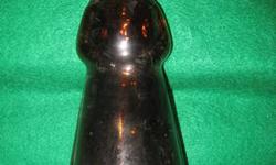 What I have for sale are two collectable Mrs. Butterworth figural bottles.
The one with a metal cap. All original in amber glass. Bottle measures 10"H x 3-3/4" at the base. On base it has the number 72 on the base. I assume that means 1972. The bottle has