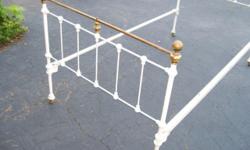 Two antique twin iron beds that are at approx 100 years old or better in great condition