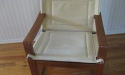 These two chairs that I have are exactly alike. The first two photos are of my chairs (the ones with the hardwood floor). The rest of these photos are of a similar chair that I do not have (I copied those photos from a web site).
These teak armchairs have
