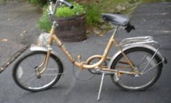 Two folding bicycles in very nice condition.............one gold and one silver. Great to throw in the trunk of a car or to take along on a boat trip.