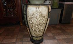 large grecian urn with beautiful and different decor from each angle.