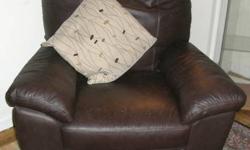 Used Dark Brown Leather Rocking Chair. 42" wide x 35" deep. The seat has some scratches from my cats but other than that, there is no other damage. The chair is in very good working condition. This chair was purchased from Ikea and is @ 3 years old with
