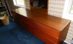 (Danish) modern teak wooden bedroom set. Includes 1 headboard, 1 triple-wide dresser, including mirror, 2 end tables, and 1 desk. Used. Good condition!
If interested, please contact me to arrange for pick-up.