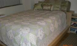 Used Ikea light birch queen size bed with headboard and headboard unit with extending end tables. This is in excellent condition, only 3 years old and I travel for work so it has seen little use. The box spring is by Serta, I AM NOT SELLING THE MATTRESS,