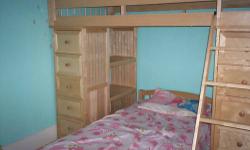 Solid wood twin bunk bed with 4 shelves and 10 drawers. This bunk bed is in very good shape it is just to big for my daughters room. We are asking $425.00 OBO. Single Mattress can be included for extra $20. Please email or call with any questions.
