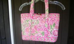 The last picture shows all the Vera and Coach bags that we are selling.
This listing is for a really pretty Vera Bradley tote/purse that is in nice condition. It is such a pretty pattern of pinks/greens and think this might be the Vera pattern/color